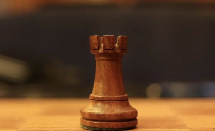 A rook chess piece.