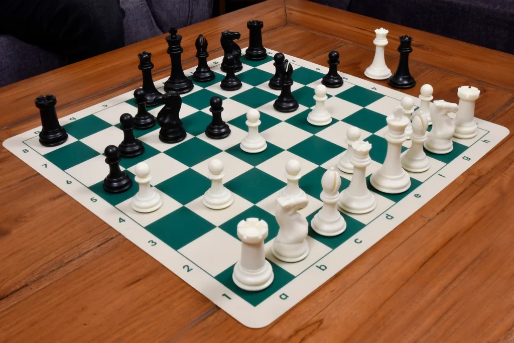 A plastic chess set placed on a table.